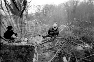 Protesters occupy a net high in the trees as bailiffs evict the Newbury Bypass protest camp known as 'The Kennet' while tree surgeons fell tress beneath them.