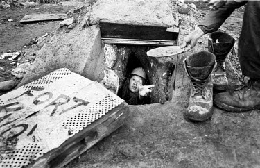 A tunneller surfaces for a breakfast of fried potatoes at Fort Trollheim, an anti-road protestor's camp on the A30 route between Exeter and Honiton. This camp was built in the summer of 1995 from tree...