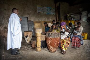 A priest leads a church service of Batwa (pygmy) people who were displaced from their forest homes. Until 1992 the Batwa people lived in the forests of Western Uganda but they had to make way for the...