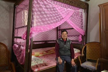 Mr Tung Shui-lun (80), who has lived on Kinmen Island all his life, sitting on the traditional wooden bed that belonged to his father (and has never been moved from this room) inside his ancestral hom...