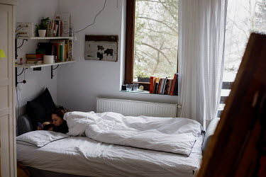 Kasia, 20, an Anthrozoology student, on her bed. All lessons have been online since the pandemic began in March 2020. ~~'Fatigue and frustration build up. I have cut myself off from social media becau...