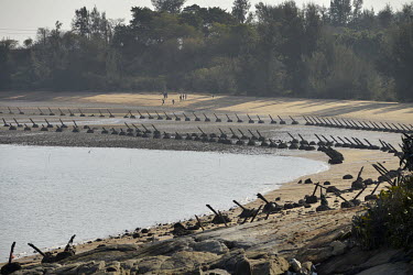 Angled metal spikes, positioned to repel amphibious invasion, line a beach on Xiao (Little) Kinmen Island, just a mile or two from the Chinese mainland.   Following the retreat of Chiang Kai-shek's na...