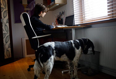Jedrzej, 16, a secondary school student, at home during his online lessons. All lessons have been online since the pandemic began in March 2020.  'Family relations have worsened, everyone is nervous,...