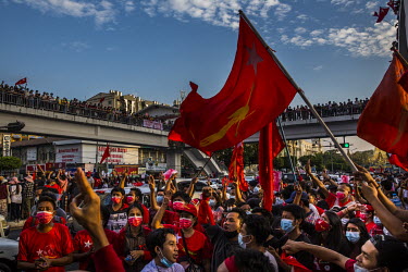 Large crowds of flag waving protesters gather in Yangon to protest against the military coup. On 1 February 2021, the military seized power, deposing the democratically elected government led by Aung...