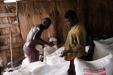 Salt being bagged at the market in Kasseh. The market town serves the surrounding region, including the communities around the salt-rich Songor Lagoon.  The salt-rich Songor Lagoon was historically a...