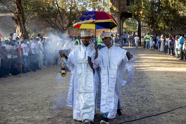 Priests burning incense during the Timkat procession, celebrating the baptism of Jesus and the Orthodox Epiphany. The official slogan for the 2021 celebrations was 'Ethiopia's Rebirth at Gondar's Timk...