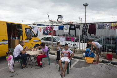 A Roma family camping in a car park near the port of Igoumenitsa.
