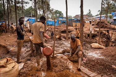 People working on the surface at an informal gold mine.