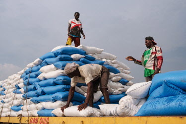 A truck being loaded with salt destined for Burkina Faso on the edge of the 'Yomo', the area traditionally held to be the spiritual heart of the salt-rich Songor Lagoon. It is traditionally taboo to w...