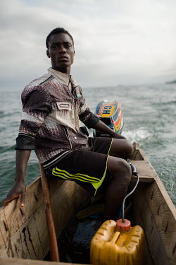 Jonas Asideka, a boat pilot, an hour offshore during a fishing trip on Lake Volta.