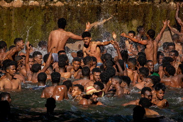 After priests haved blessed the water at the Fasiladas Baths during Timkat (a celebration of the baptism of Jesus and the Orthodox Epiphany) pilgrims begin to jump into the water to purify themselves....