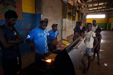 Thamarrurr youth leaders cook a barbeque for children visiting the Thamarrurr youth centre during the school holidays.