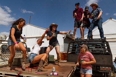 Partygoers dance on top of pick up trucks ('Utes') during the Ariah Park Bachelor and Spinster ball.  Known to locals as simply B&S balls, the events are held regularly in rural towns, run by local...