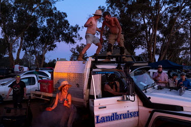 Partygoers dance on top of a truck at the start of the Ariah Park Bachelor and Spinster ball.  Known to locals as simply B&S balls, the events are held regularly in rural towns, run by local volunte...