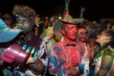 Partygoers covered in food dyes at the Ariah Park Bachelor and Spinster ball. Although food colouring is technically banned at the ball (security guards search patrons as they enter) It is still popul...