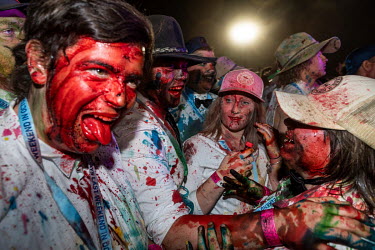 Partygoers covered in food dyes at the Ariah Park Bachelor and Spinster ball. Although food colouring is technically banned at the ball (security guards search patrons as they enter) It is still popul...