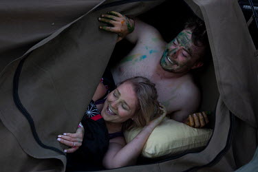 A couple wake in their swag (bivouac) on the morning after the main party at the Ariah Park Bachelor and Spinster ball.~~Known to locals as simply B&S balls, the events are held regularly in rural tow...