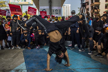 A group of young hip hop dancers perform a routine protesting the military dictatorship and to show support for the Civil Disobedience Movements.