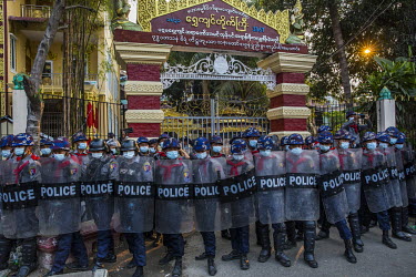 Riot police form a line at the entrance of a monastery known to be linked to the ultra-nationalist Patriotic Association of Myanmar (Ma Ba Tha) after locals who say a group of pro-military thugs, incl...