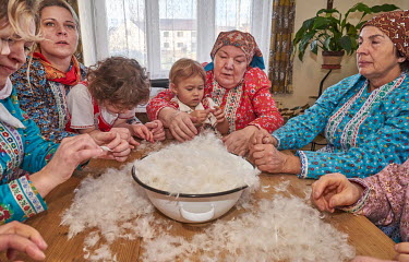 Women from the Chod folklore group prepare goose down for use as stuffing.