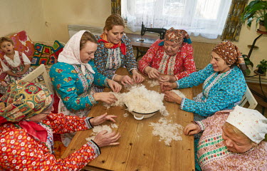 Women from the Chod folklore group prepare goose down for use as stuffing.