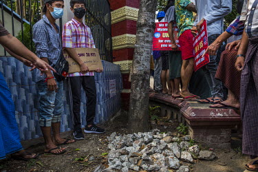 Pro-democracy protestors point at a pile of rocks outside a monastery said to be known for its nationalist, pro-military supporting monks. It is claimed that the rocks are there for right wing monks a...