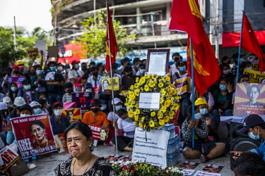 A woman cries in front of a memorial to Mya Thwet Thwet Khaing, a young woman who was shot in the head by the security forces in Naypyitaw on 9 February 2021 and died in hospital ten days later.