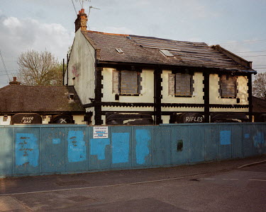 The abandoned 'Rifles' pub, formerly known as the Royal Small Arms Tavern. Established in Enfield Lock in the 1860s to accompany the rifle manufacturer of the same name, the tavern went into decline w...
