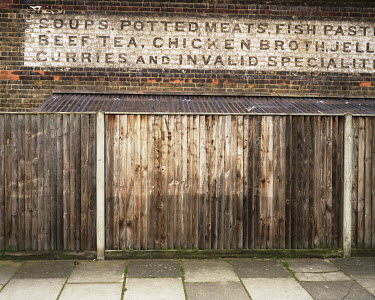 A faded sign for William Whiteley's Farm and Depot in Fulwell.