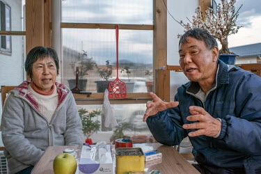Mr Hideo Endo and Mrs Kazuko Endo in their new house built only seven kilometres away from the Fukushima Daiichi Nuclear Power Plant. One of several houses in an estate built for returnees to the town...