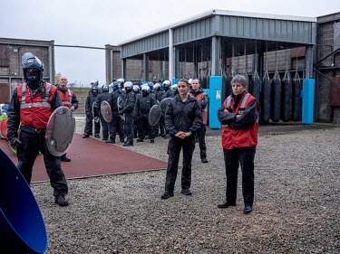 Metropolitan Police Chief Cressida Dick looks on as instructors brief officers during a police crowd control exercise at the Metropolitan Police training centre in Gravesend.
