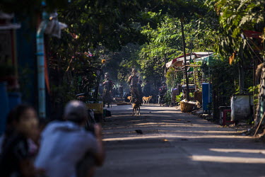 Soldiers occupy an alley inside the compound of the railway staff quarters where security forces are deployed to carry out a raid aimed at staff who are participating in the Civil Disobedience Movemen...