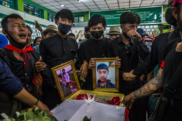 Friends and fellow student union members mourn at the funeral of Sithu Shein (18) who died when military and police joint security forces fired live rounds during their crack down on anti-coup protest...