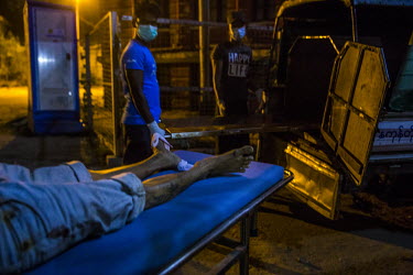 Volunteers, operating as discreetly as possible so as not to attract the attention of the security forces, move the dead body of an unidentified anti-coup protestor who, according to medics who transp...