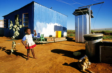 A child plays outside in a new housing development.