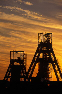 A gold mine's head gear silhouetted against the evening skyline.