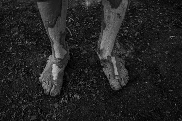 A worker's feet caked in clay at an artisanal brick factory on the Panelas Creek on the outskirts of Altamira. They used to use the clay found in the Xingu floodplain to produce bricks, but with the f...