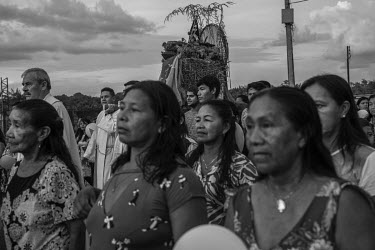 People participate in a Catholic procession in a city where about 90% of the 45,000 inhabitants are indigenous people.