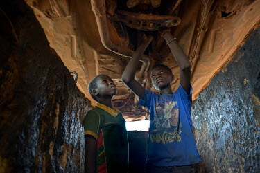 Yamba (12) (left) an apprentice mechanic since October 2020 at the Wend-Panga garage. His family fell into poverty due to the economic crisis linked to COVID-19 and could not send all of their childre...