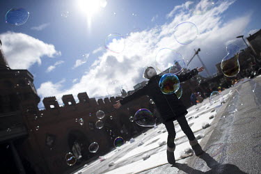 Children playing with soap bubbles on the closed Oberbaum Bridge during a protest calling for a 'Global Day of Climate Action' under the slogan 'Another World Is Possible'.