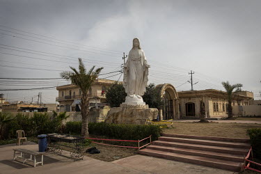 A rebuilt statue of the Virgin Mary in the grounds of the new Mar Goris Syrias-Catholic church (St George) which was burned and badly damaged by ISIS terrorists when they took control of the region in...