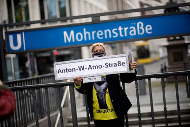 A protestor holds a sign at Mohrenstrasse U-Bahn station while campaigning for the street to be renamed after Anton Wilhelm Amo, the black academic in Germany. Members of the local African diaspora an...