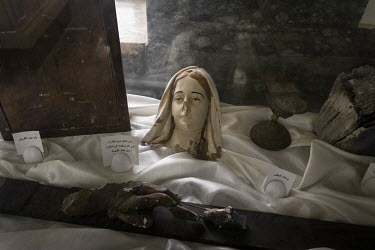 The damaged head of a statue of the Vigin Mary, one of the holy relics on display at the new Mar Goris Syrias-Catholic church (St George) which was burned and badly damaged by ISIS terrorists when the...