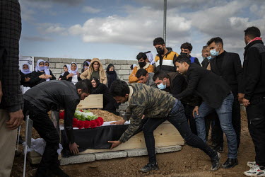A Yazidi family bury the remains of a young male relative, one of 103 people from the village murdered by ISIS in 2014. Having been exhumed from the mass graves where they were dumped by ISIS, the vic...