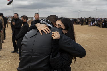 Nobel Peace Prize Laureate Nadia Murad cries as she is embraced by her brother Khalid during the funeral ceremony for 103 Yazidi victims of ISIS, including two of their brothers, who mudered and dumpe...