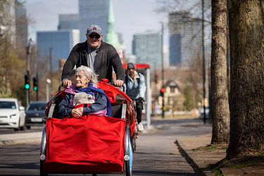 Doug, a volunteer for Cycling Without Age an organisation providing cycle rides for the elderly on specially designed trishaws, takes his mother Patricia for a ride around Southwark.