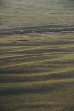 Undulating meadows located in the vicinity of the Kyrchyn Gorge.