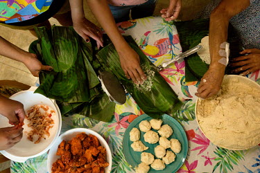 Karina Pantoja makes tamales with her mother, Ruth, sister-in-law, Yuliana and niece, Yanelle at her parents' apartment in Whittier. Ruth was teaching them how to make tamales in the traditional way a...