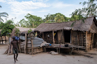Moise Avihoue carrying his fishing net to the river in the village of Dekanme on the Oueme River. Dwindling fish stocks are one of many factors that accelerate pressure on forests, as people must inst...