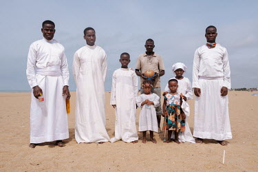 A family belonging to the Celestial Church of Christ worshipping on the beach. Founded in Benin in 1947, the church forbids idolatory, fetish ceremonies, cult membership, sorcery or amulets and charms...